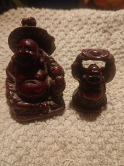 2 miniature red resin happy Buddha figurines for sale.