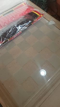 Glass chess and plastic pieces