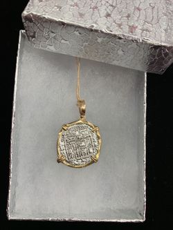 Atocha silver coin with gold bezel