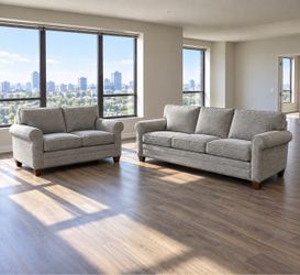Gray couch and loveseat. Delivery Available.