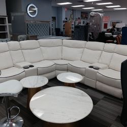 All white breathable leather sectional with it compolder storage.