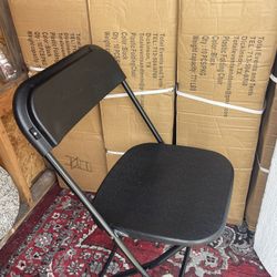 Folding chairs for sale: a box of 10 brand-new chairs.