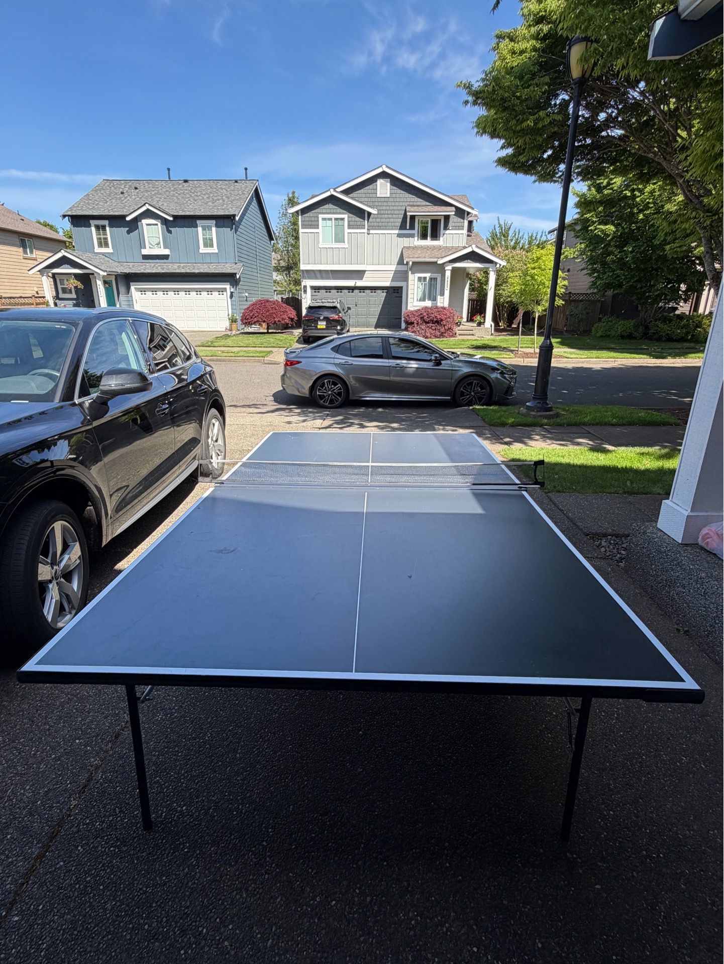 Ping pong table with paddles and balls