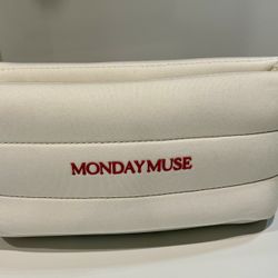 The  limited-edition, cream-colored quilted puffer pouch  "MONDAY MUSE"