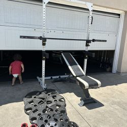 Bench press/squat rack with 7ft bar plus 255lbs of Olympic weights