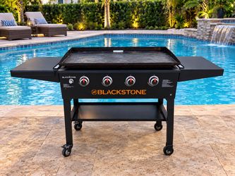 Delivery Available! Blackstone Natural Gas 4 Burner Griddle Grill! Works great. Retails $499.99. Will not work with propane tank, set up for natural g