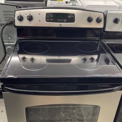Used GE 4 Burner Glass Top Black And Stainless Steel Range. 1 Year Warranty 