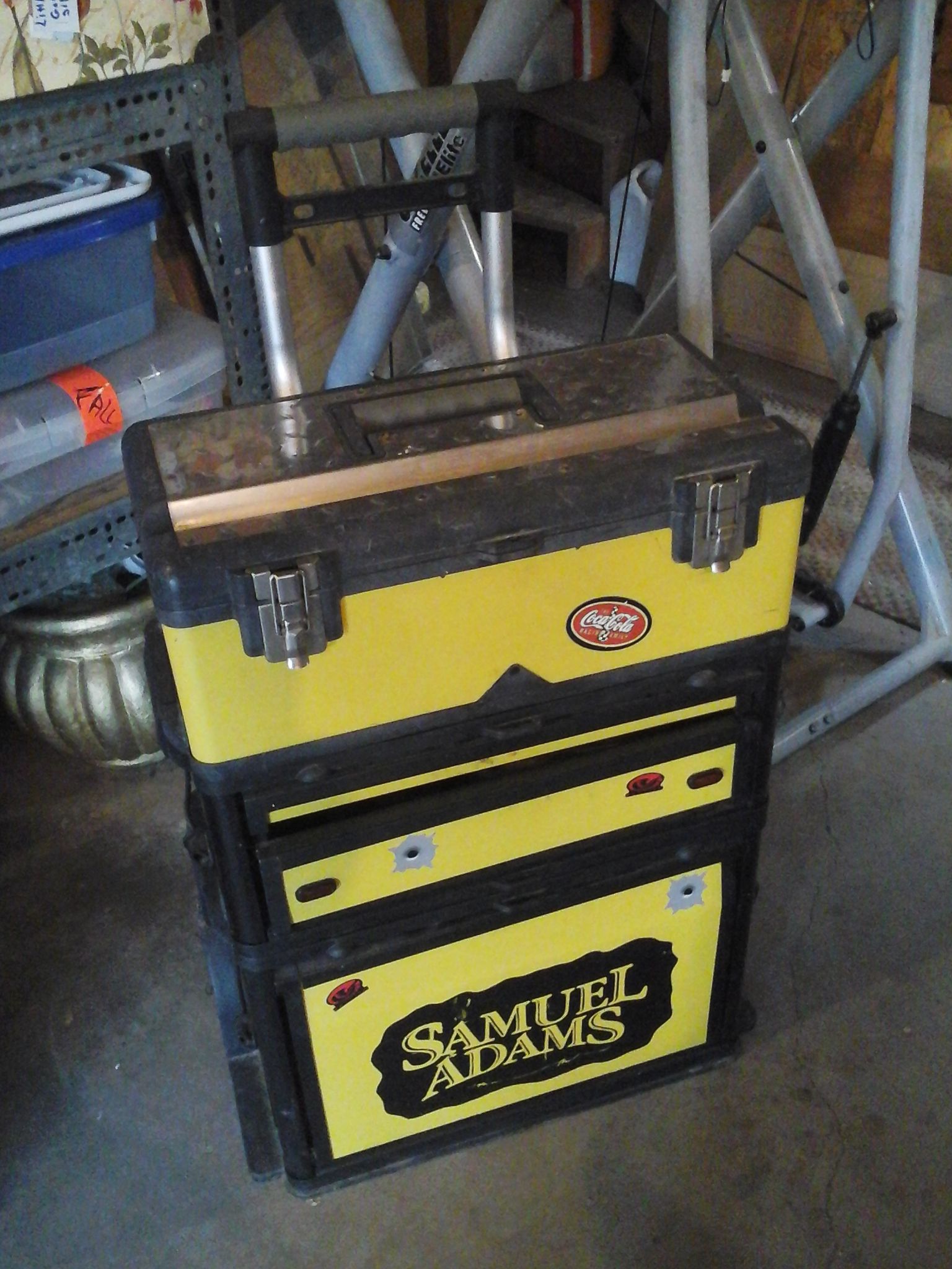 Stanley tool chest on wheels. Compartments have items in them