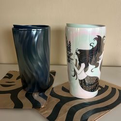 2 Insulated Starbuckstumblers Porcelain Cups Brand New one metallic green subzeroceramic/ white mermade For $18.00each One Come With Lids /both grande
