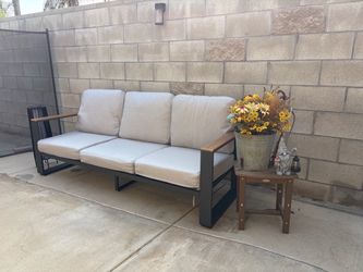 3-seat outdoor sofa with curtains