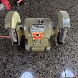 Black & Decker model 7900 bench grinder powers on, goes slow, makes noise