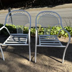 Vintage Stacking Wrought iron white chairs set up two