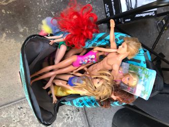 Back pack full of Barbie dolls