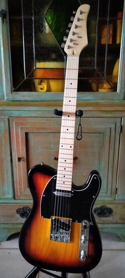 Brand new telecaster electric guitar with new gig bag cable and shoulder strap