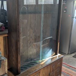 Nice solid oak rifle and fishing pole Glass cabinet