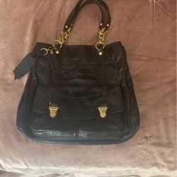 Coach Bag, brand new in perfect condition. Lots of different compartments. Inside is a beautiful pink color seen in pic