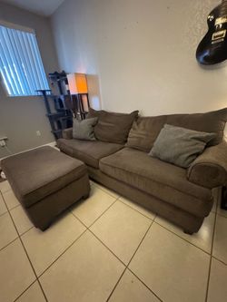 Brown comfy synthetic fabric couch with ottoman