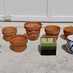 Preowned bunch of clay and glazed flower pots