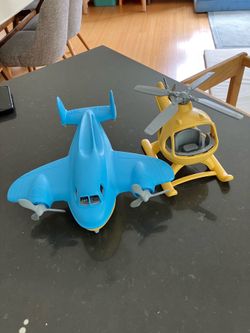 2 green toys helicopter and airplane