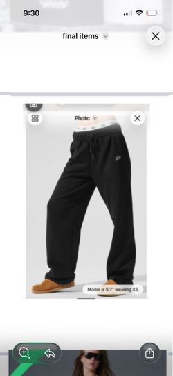 Versatile Alo Yoga sweatset in black. This set includes a cropped long-sleeve sweatshirt with a crew neck and matching straight-leg sweatpants with a 