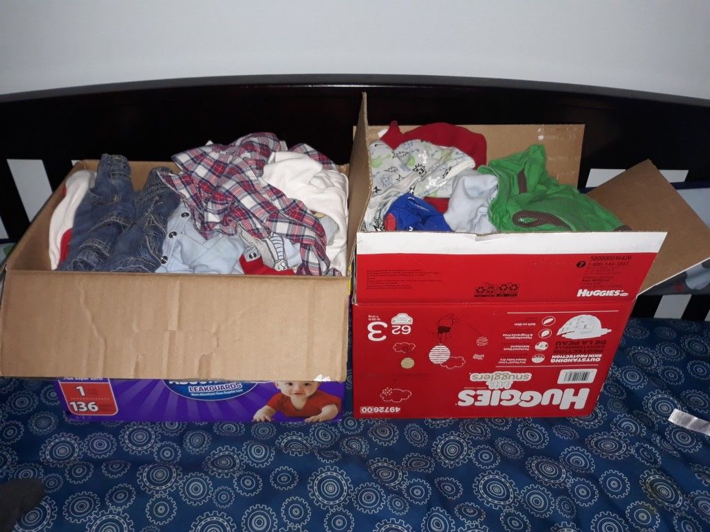 2 boxes of baby clothes