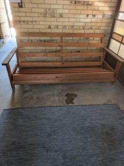 Solid wood futon frame only.