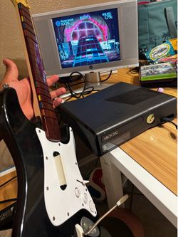 Xbox 360 with rockband 2 guitar and game