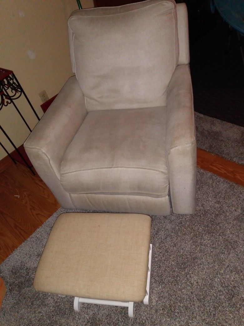 Recliner with free extra gray cover and footrest.