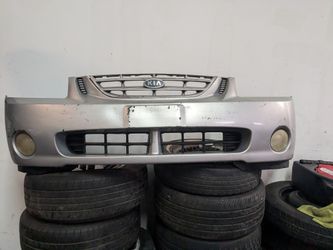 04 to 06 Front Bumper For Kia Spectra  with The 3 Grills and the 2 Fog Lights 
