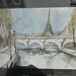canvas art print of Paris which depicts a view of the Eiffel Tower along the Seine River.