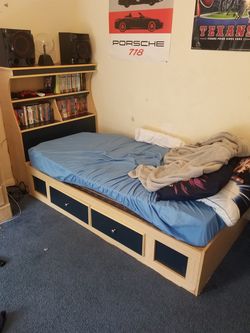 Twin bed frame with 2 drawers and head board.