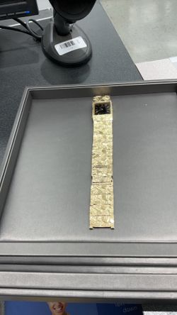 vintage Seiko 10KT gold nugget watch featuring a rectangular black dial