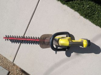 Ryobi Cordless Hedge Trimmer comes with battery and charger