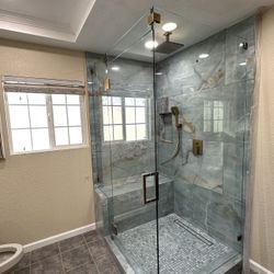 FRAMELESS SHOWER ENCLOSURE
