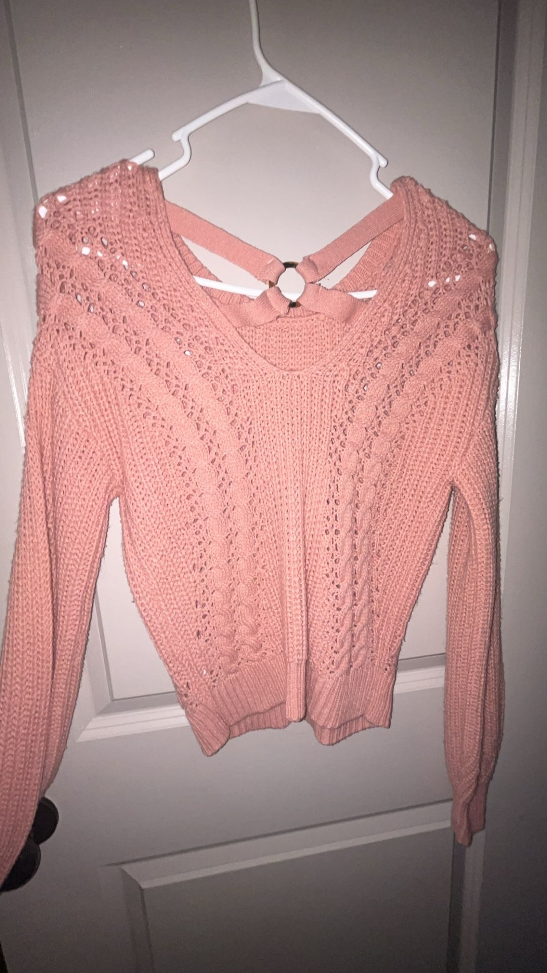 Pink Sweater with some Holey Designs 