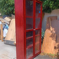 Red Mahagany look with  5 Shelves Behind 2 Glass Doors 