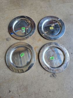 Set of 4 saucer size silver plated plates each with the letter "E" etched on them