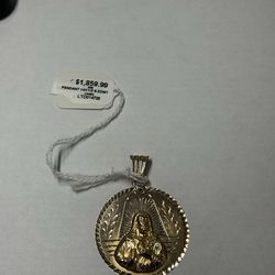 Round gold Saint pendant