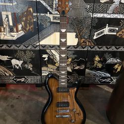 Keith Urban Electric Guitar  Brand new. Price is firm.  Minor Defect.   Strap, picks and amp included. Never used. I received it this way, it has a mi