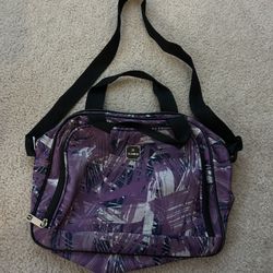 Purple Carry-On Travel Bag, slips on Suitcase handle for easy transport 