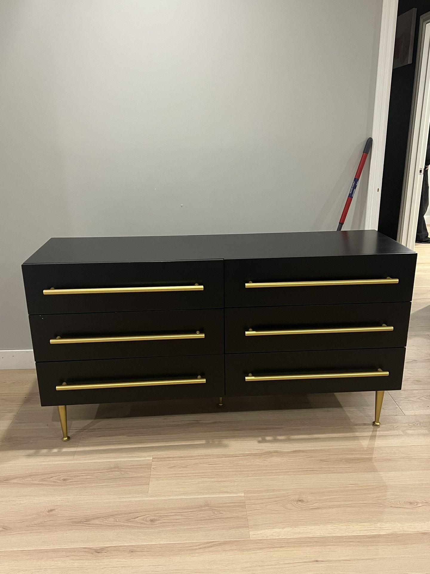 Black Dresser With Gold Handles Is Used, But In Good Condition Has Some Chipping