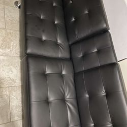 Black futon with cup holders