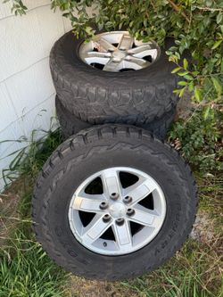 285 70 17 tires Chevy Silverado Tahoe Suburban GMC Yukon Sierra Cadillac Escalade stock wheels Rams tires 80%