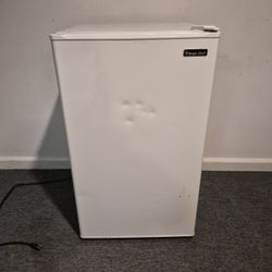 Mini Magic Chef Refrigerator. It's a compact appliance, popular for bedrooms, offices, or small spaces.