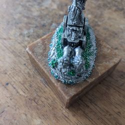 Collectible miniature likely depicting King Arthur in chariot