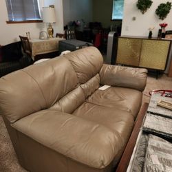 Creame Colored Leather Loveseat. 