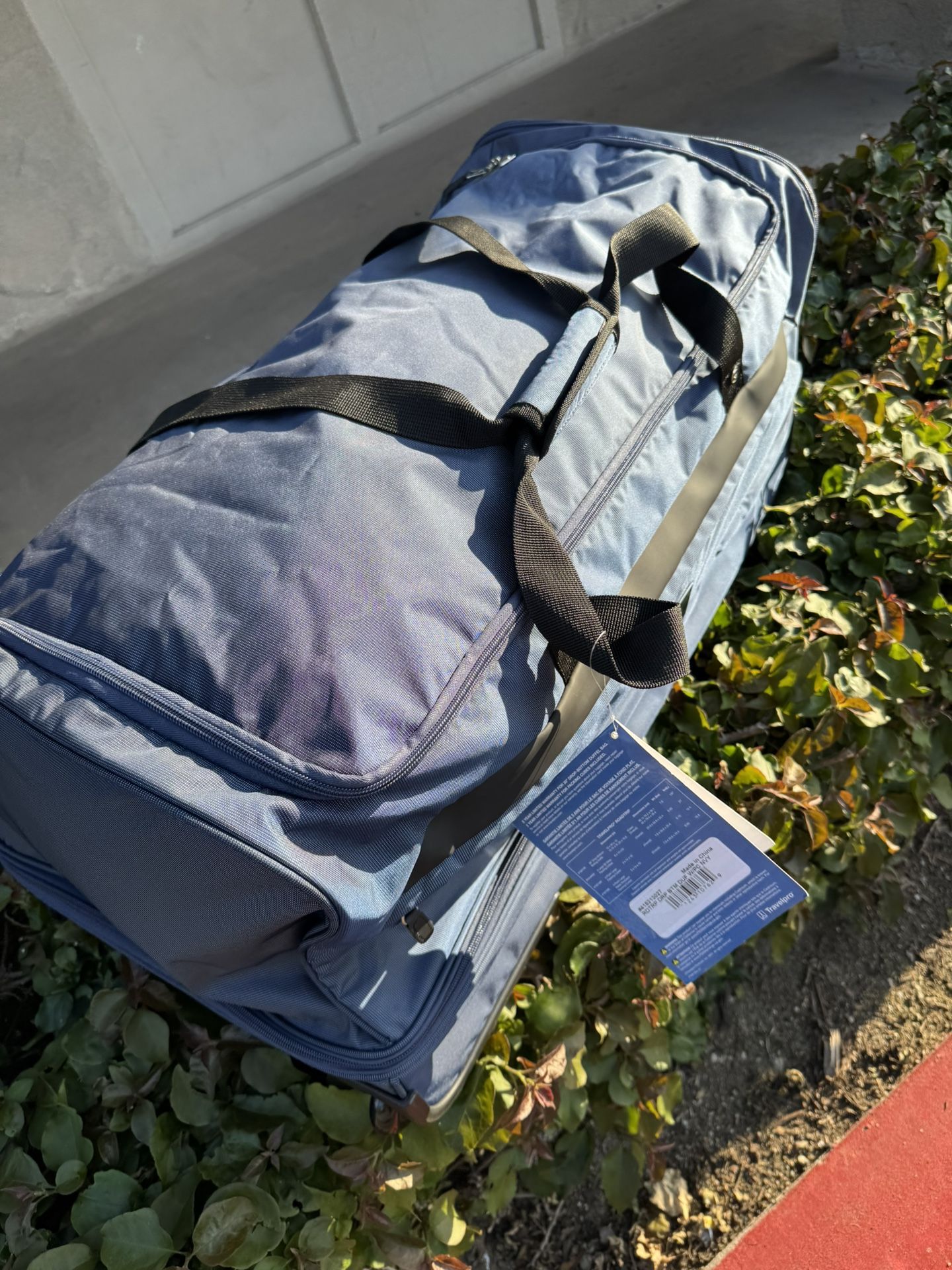 TravelPro Rolling 30” Split Compartment Duffle Bag Luggage