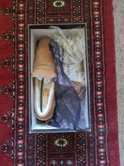 Genuine soft tan leather loafer with genuine sheep shearling  fur.  Size 9.  Bloomingdale's, Never worn.  New.