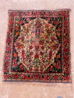 Antique small nodded Persian Rug