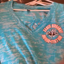 Earls Hideaway in Sebastian woman’s short sleeve, V-neck light blue shirt